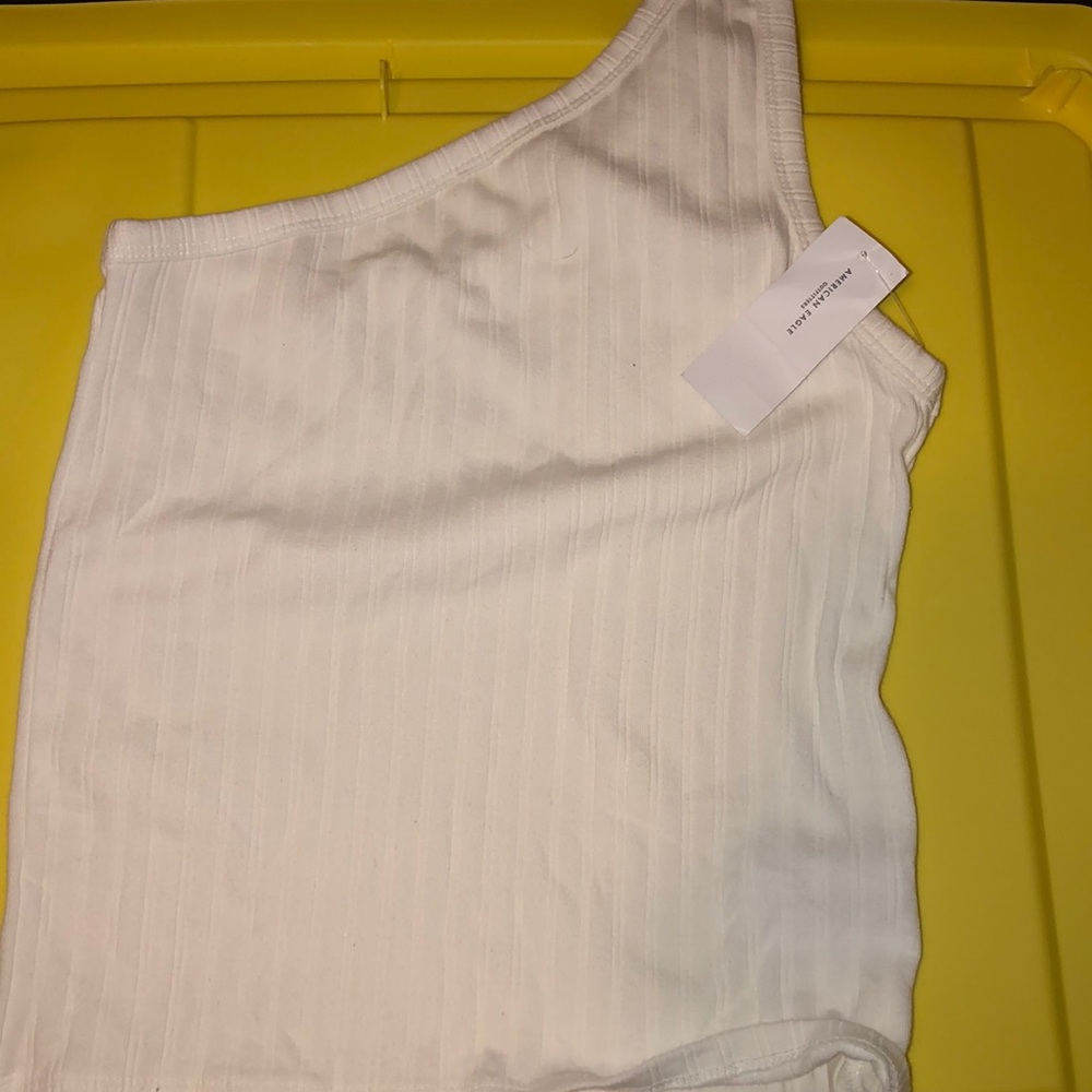 One shoulder white top